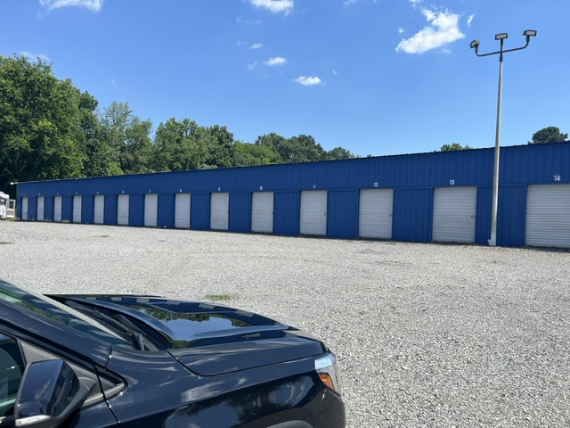 A long blue Ninety Ten Storage building with drive-up units in Conway, Arkansas